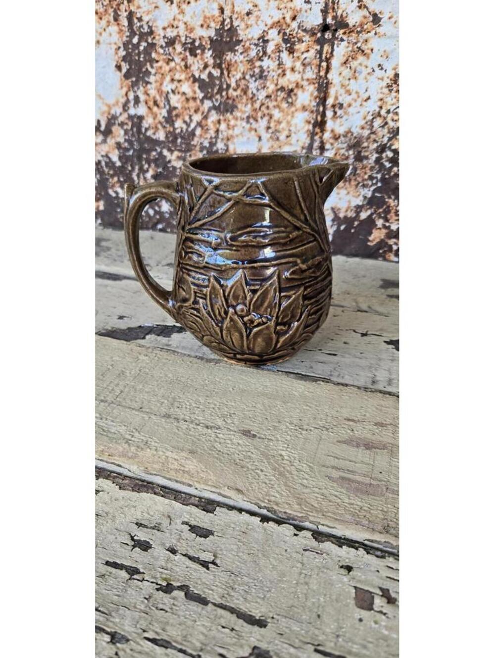 VIntage Ceramic pitcher with embossed water lily lotus design by McCoy Pottery